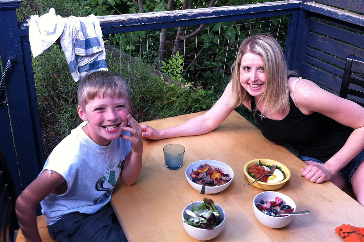Bre and her nephew enjoying an outdoor meal.